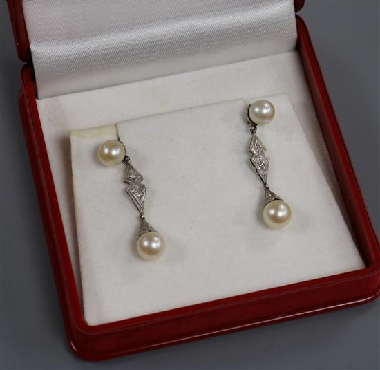 A pair of modern white metal, cultured pearl and diamond drop earrings, 34mm.